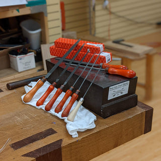 Bad axe tool works with friedrich dick saw files on display against an anvil