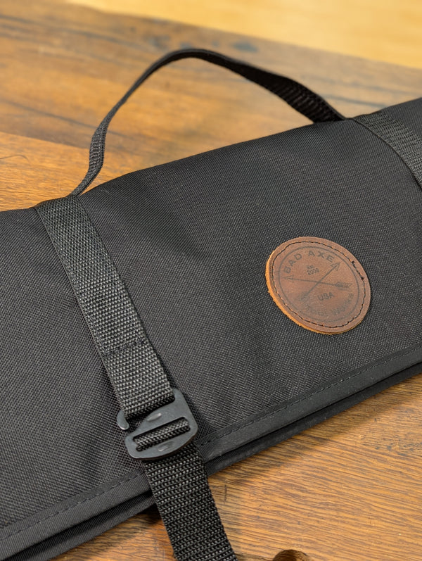 a leather patch on a black saw bag