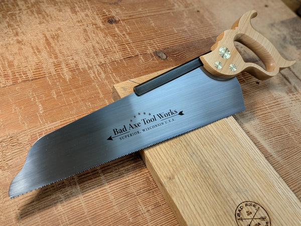 a 14 inch half back saw with a maple handle and brass hardware by bad axe tool works