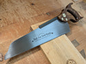 a 14 inch half back saw with a walnut handle made by bad axe tool works