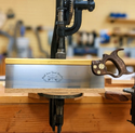 a 14 inch sash saw with a walnut handle and brass fasteners with a titanium back